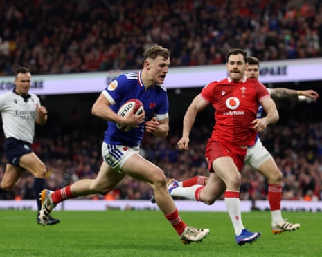 Gailleton breaks away from Williams of Wales to score a try.