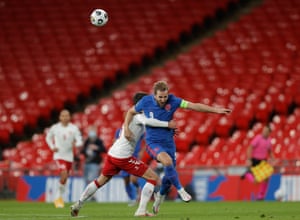 Harry Kane of England is foulded by Denmark’s Andreas Christensen, who goes into the book.