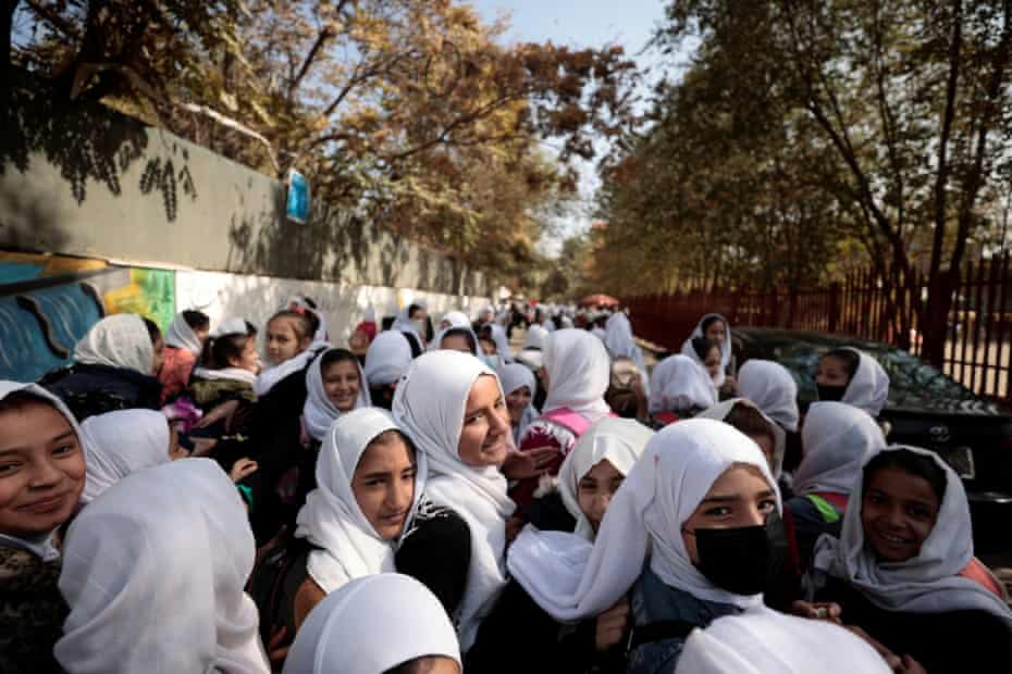 Female primary school students leave school after a class in Kabul, Afghanistan, 25 October 2021.
