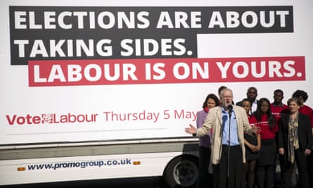Jeremy Corbyn stands in front of a Labour campaign poster before the local elections last Thursday.