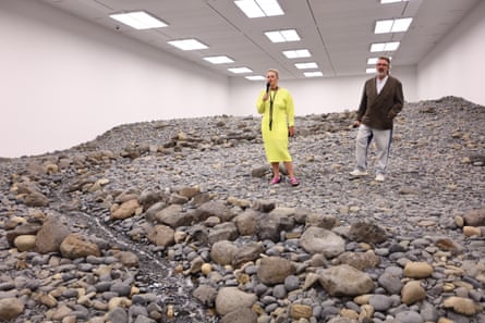 Gerraldine Kirrihi Barlow and Olafur Eliasson stand in Riverbed (2014) at Goma.