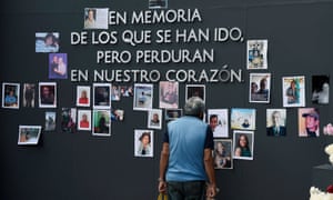 A man observes a tribute to the almost 300 thousand people how died in Mexico from Covid complications ahead of the Day of the Dead in Mexico City on 29 October.