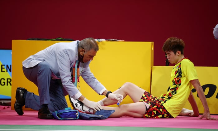 Tze Yong Ng of Malaysia receives medical treatment during the final.