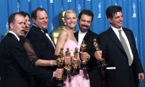 ‘Shakespeare in Love’ Best Actress winner Gwyneth Paltrow (center) is joined by Harvey Weinstein (center left) backstage as they celebrated their win of Best Picture at the 1999 Academy Awards.