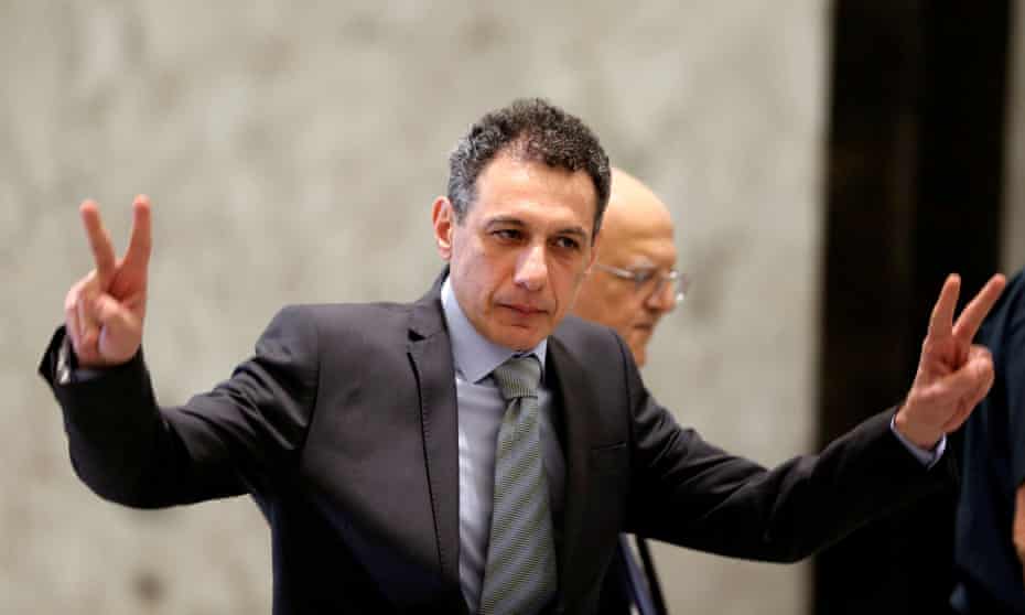 Freed Lebanese businessman Nizar Zakka, who had been detained in Iran since 2015, gestures as he arrives at the presidential palace in Baabda, Lebanon, on 11 June.