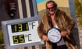 A man in a fur jacket next to a thermometer
