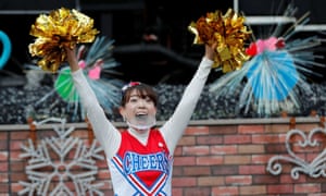 Cheerleaders dance to cheer people up in Tokyo amid the coronavirus pandemic.