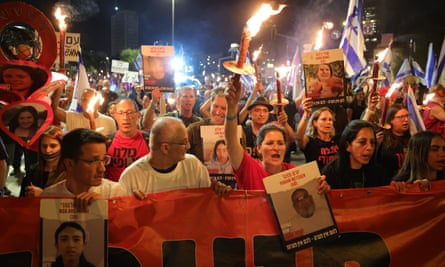 Protesters outside the Knesset in Jerusalem on 2 April 2024 call for the return of all hostages and the dissolution of the government.