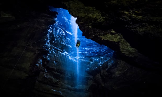 A member of the public is winched into Gaping Gill, the largest cavern in Britain