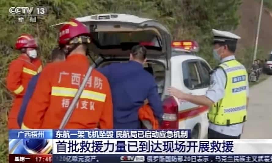 An image taken from video footage run by China’s CCTV showing emergency personnel preparing to travel to the site of the plane crash.