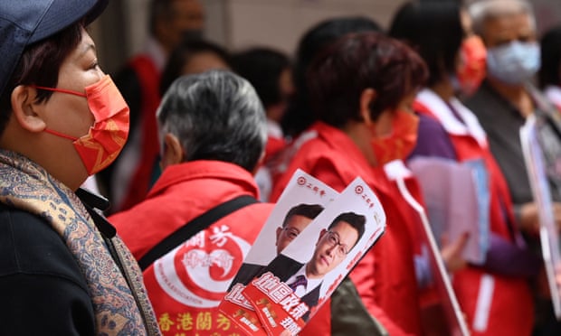 Supporters of Stanley Ng, of the Hong Kong Federation of Trade Unions, canvass for votes in the legislative council elections in Hong Kong on Sunday.