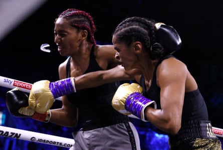 Ramla Ali lands a punch on Crystal Garcia Nova, sending her mouthguard flying