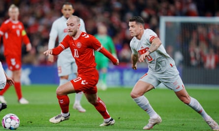 Christian Eriksen surges away from Switzerland’s Granit Xhaka during their friendly in March.