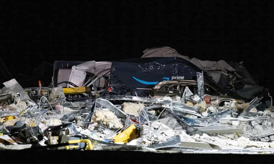 A damaged Amazon truck is seen at the site of a roof that collapsed at the Amazon distribution center in Edwardsville.