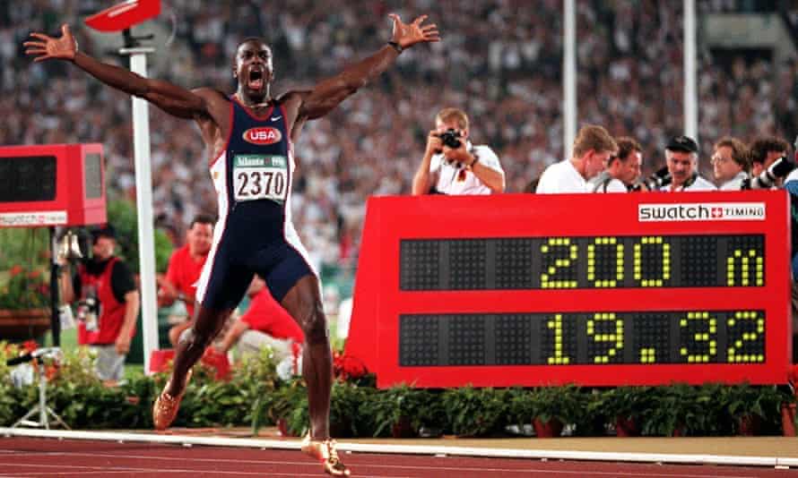 Johnson celebrates winning 200m Olympic gold in 1996 in a world record time in Atlanta.