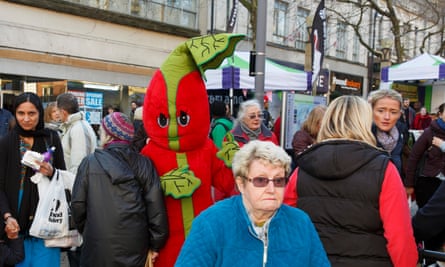 Stalker: a woman is pursued by a giant stick of rhubarb at the Wakefield Rhubarb Festival, 2015.
