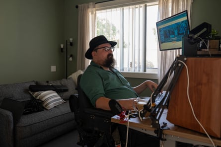 Disability advocate Jarrod Sandell-Hay works at his computer