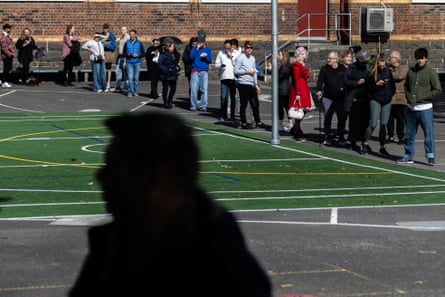 Voters line up at a polling centre at St Kilda primary school, in Melbourne.