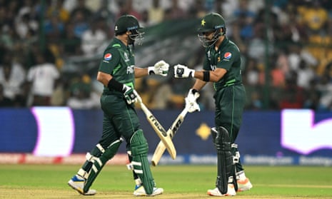 Pakistan's Imam-ul-Haq (L) is congratulated by his teammate Abdullah Shafique after scoring a half-century.