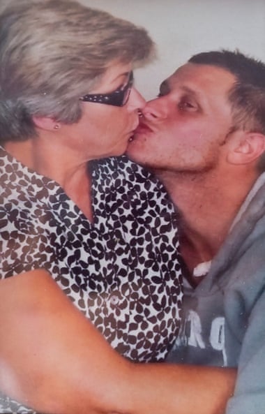 A family photo of Karen Beadle hugging and kissing her son, Garry