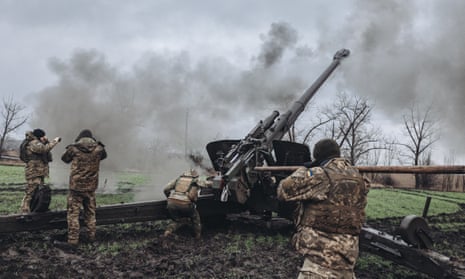 Ukrainian soldiers fire artillery on the Pisky frontline in Donetsk oblast.