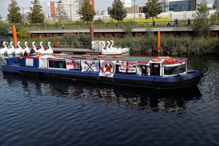 A party of West Ham fans arrive by boat