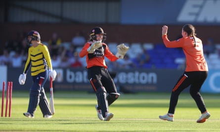 Sarah Bryce and Josie Groves show their delight after Paige Scholfield was stumped.