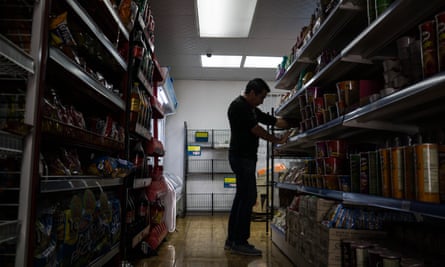 Journalist Carlos stocking shelves. Most undocumented Venezuelans only can find informal employment and are an easy prey for labor exploitation.