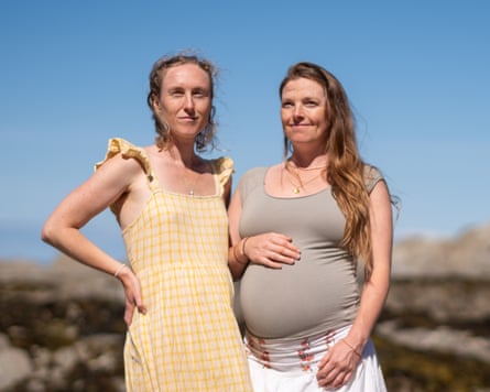 Jemima Knight and Harriet Knight standing together on a beach