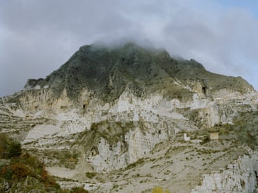 A marble quarry with its hilltop covered in cloud