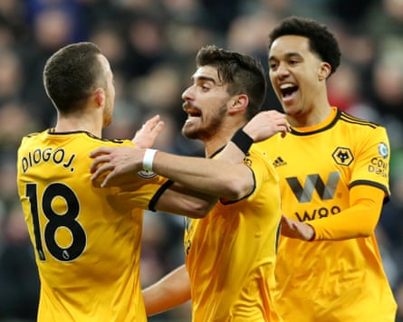 Diogo Jota celebrates scoring for Wolves in a Premier League game away to Newcastle with his teammates Rúben Neves and Hélder Costa