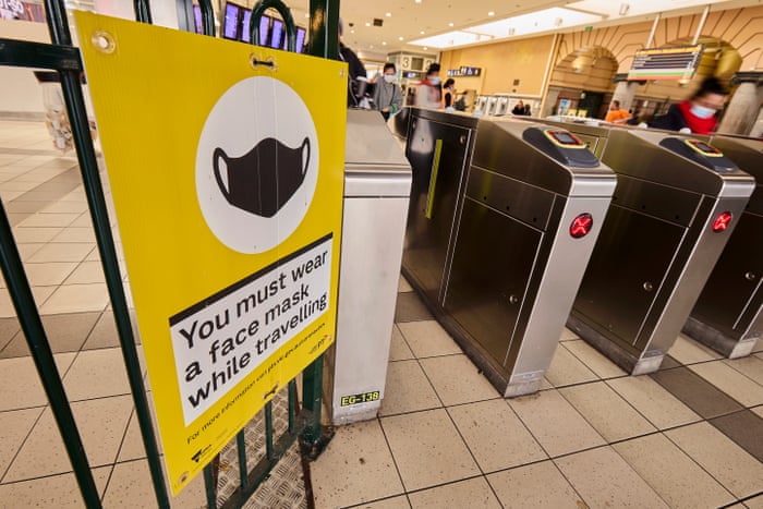 Signage encouraging commuters to wear face masks while travelling in Melbourne