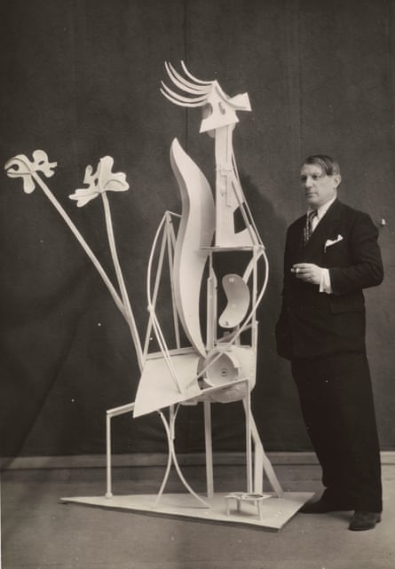 Picasso with his sculpture La Femme au Jardin, 1932.
