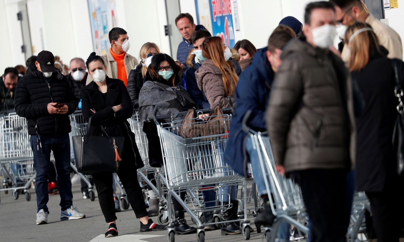 People queue at a supermarket outside the town of Casalpusterlengo, which was closed by the Italian government due to a coronavirus