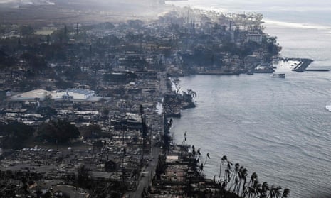 An aerial view shows destroyed homes and buildings that burned to the ground around the harbor and Front Street in the historic Lahaina Town in the aftermath of wildfires in western Maui in Lahaina, Hawaii, on August 10, 2023.