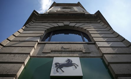 A Black Horse logo is pictured on a sign outside a branch of a Lloyds bank
