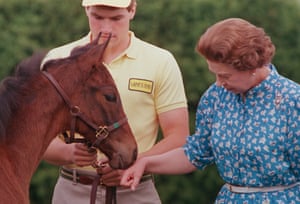 The Queen inspects a filly foal during a visit to Lane’s End Farms in Versailles, Kentucky, on 24 May 1986