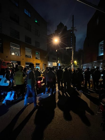 People attend a protest in central Shanghai on Sunday