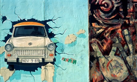 Paintings of a Trabant breaking through the Wall by Birgit Kinder and Hands by Margaret Hunter