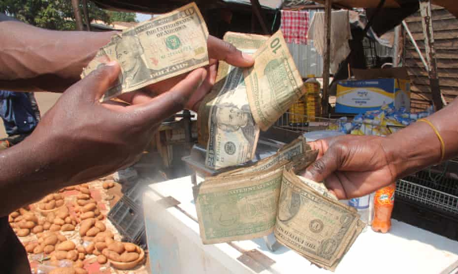 Street traders with worn out US dollars at a market in Glen Norah, Harare.
