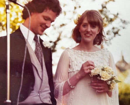 A young man and woman in wedding clothes