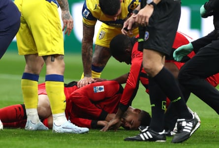 Ruben Loftus-Cheek lies injured on the pitch.