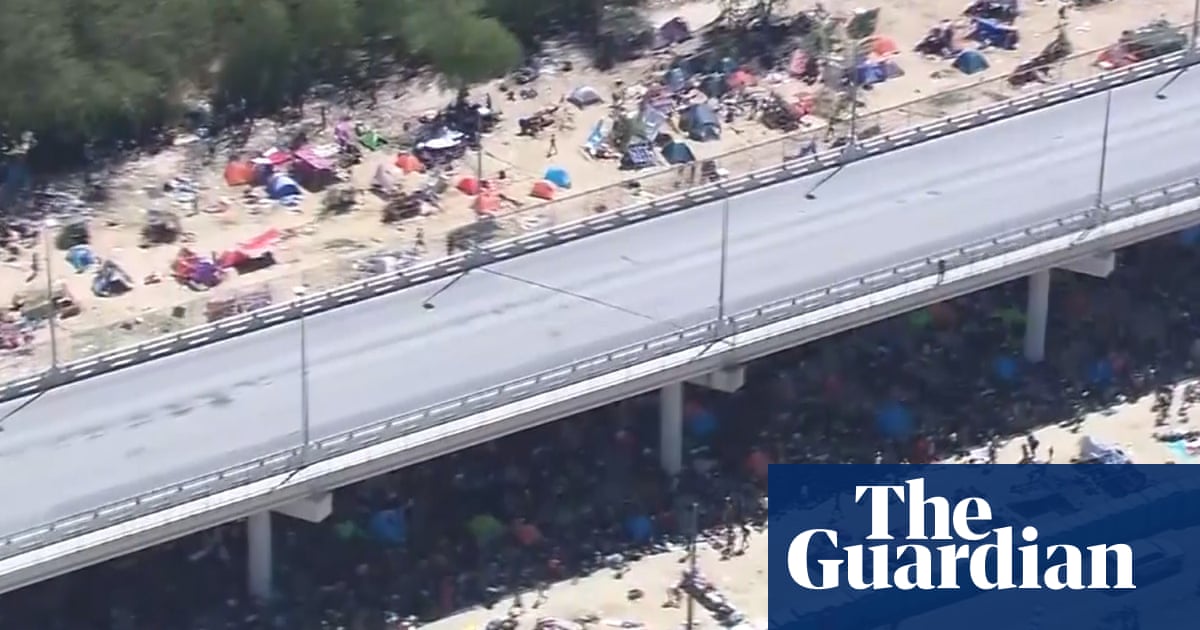 Aerial footage shows scale of makeshift migrant camp under Texas bridge – video