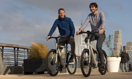 Guardian writer Alex Hern, right, tries out a new VanMoof model with Ties Carlier.