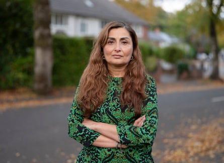 Mus stood on the street in Moseley with her arms crossed