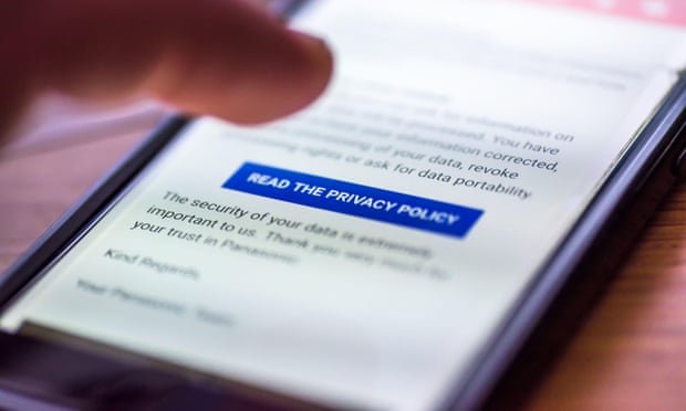 A finger clicking on a button marked 'read the privacy policy' on a smartphone screen