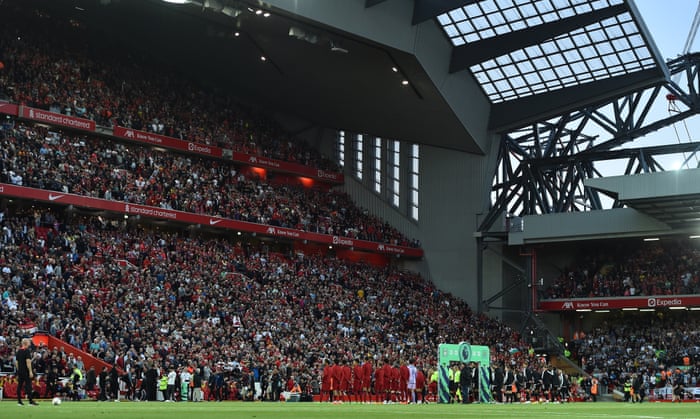 Players of Liverpool (left) and Newcastle (right) line-up ahead of kick-off.