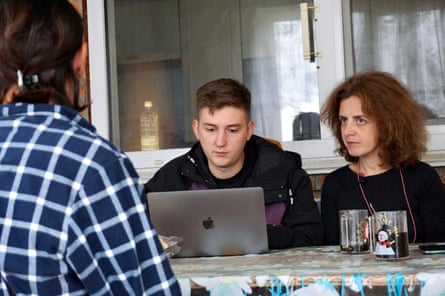 Maryna Slobodianiuk (right) and a colleague interviewing a witness.