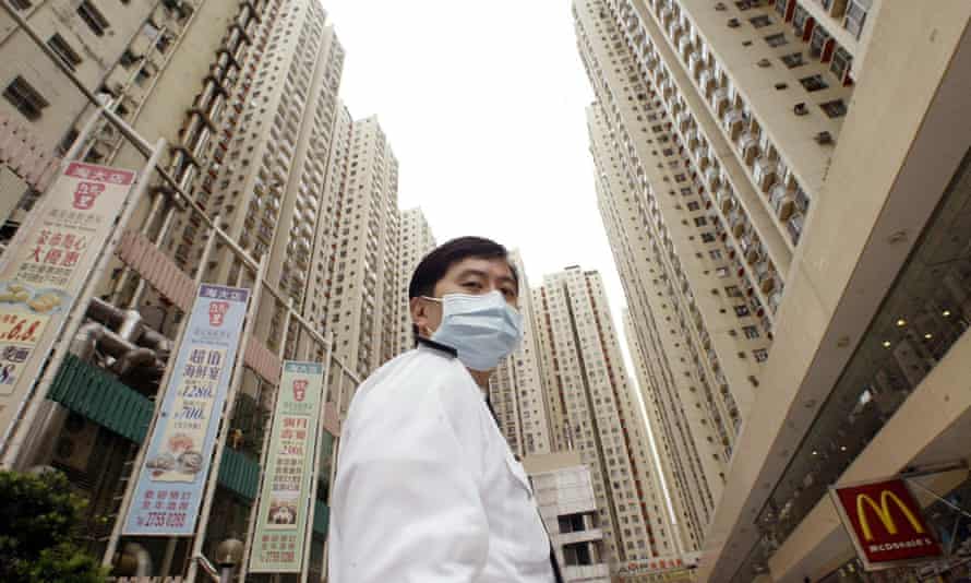 No system overhaul ... a security guard outside a quarantined housing estate in Hong Kong during the Sars outbreak.