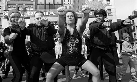 Richard Simmons, centre, is joined by two policemen and others in an outdoor workout in New York, 2000.